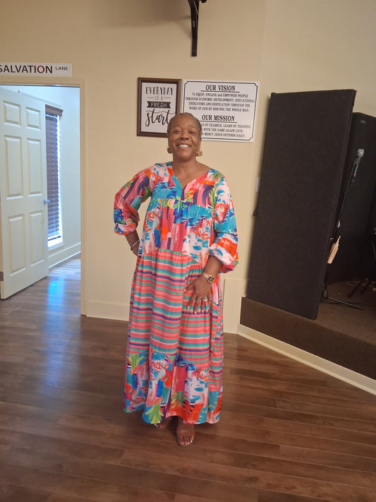 The owner Apostle Annette Higdon wearing this beautiful designer maxi dress from her store Fresh Start Variety Shop you can find beautiful items there to dress up or down we have it.