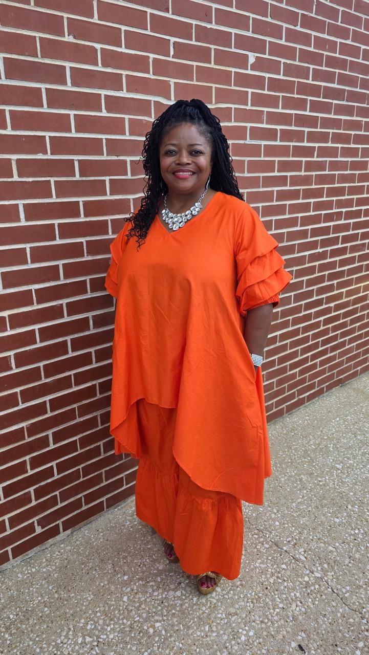 Beautiful Orange 2pc pantsuit it comes in many colors and we do have it in stock