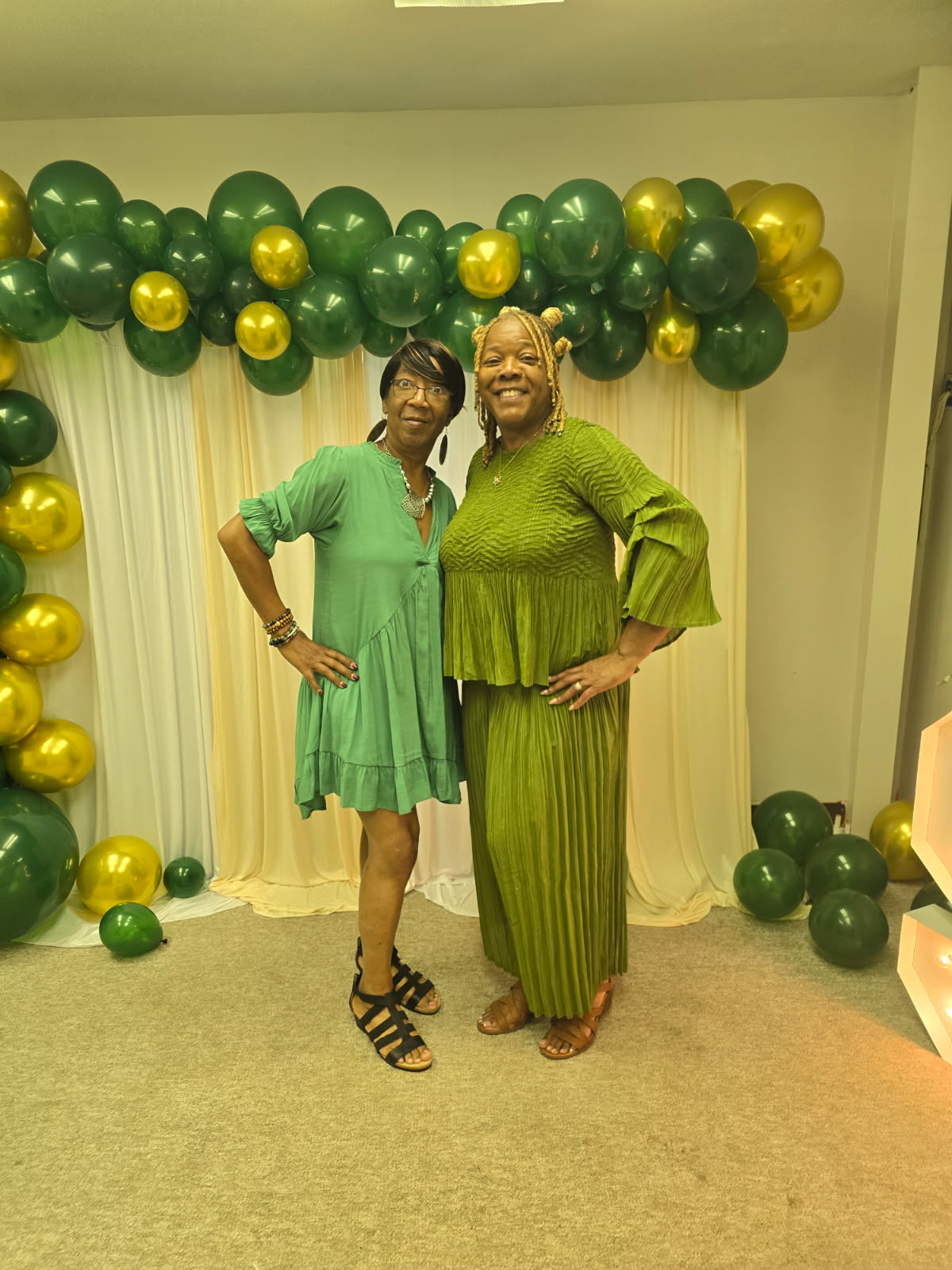 Beautiful green 2pc pantsuit wore by the owner Annette Higdon and the store manager is wearing a cute green dress we do have these items in stock online and in the store.