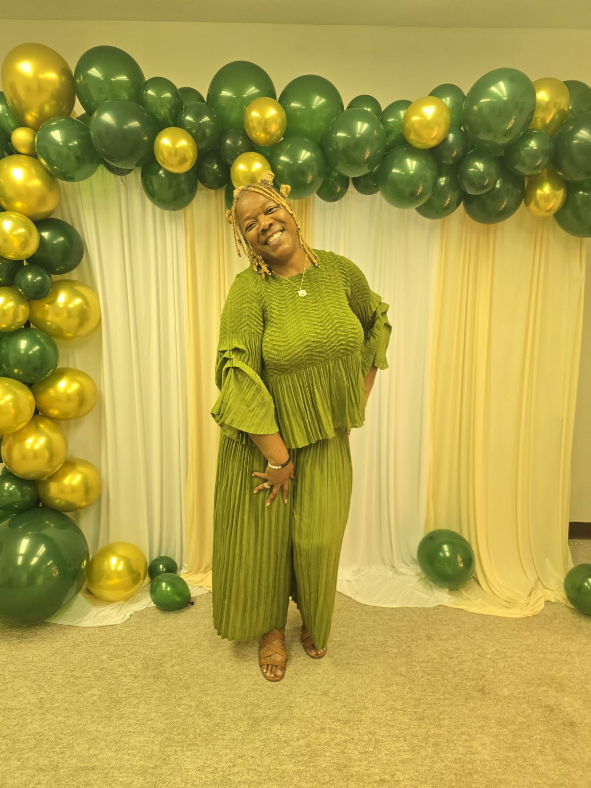 Beautiful green 2pc pantsuit wore by the owner Annette Higdon and the store manager is wearing a cute green dress we do have these items in stock online and in the store.